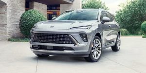 2024 Buick Envision parked outside of a nice home.